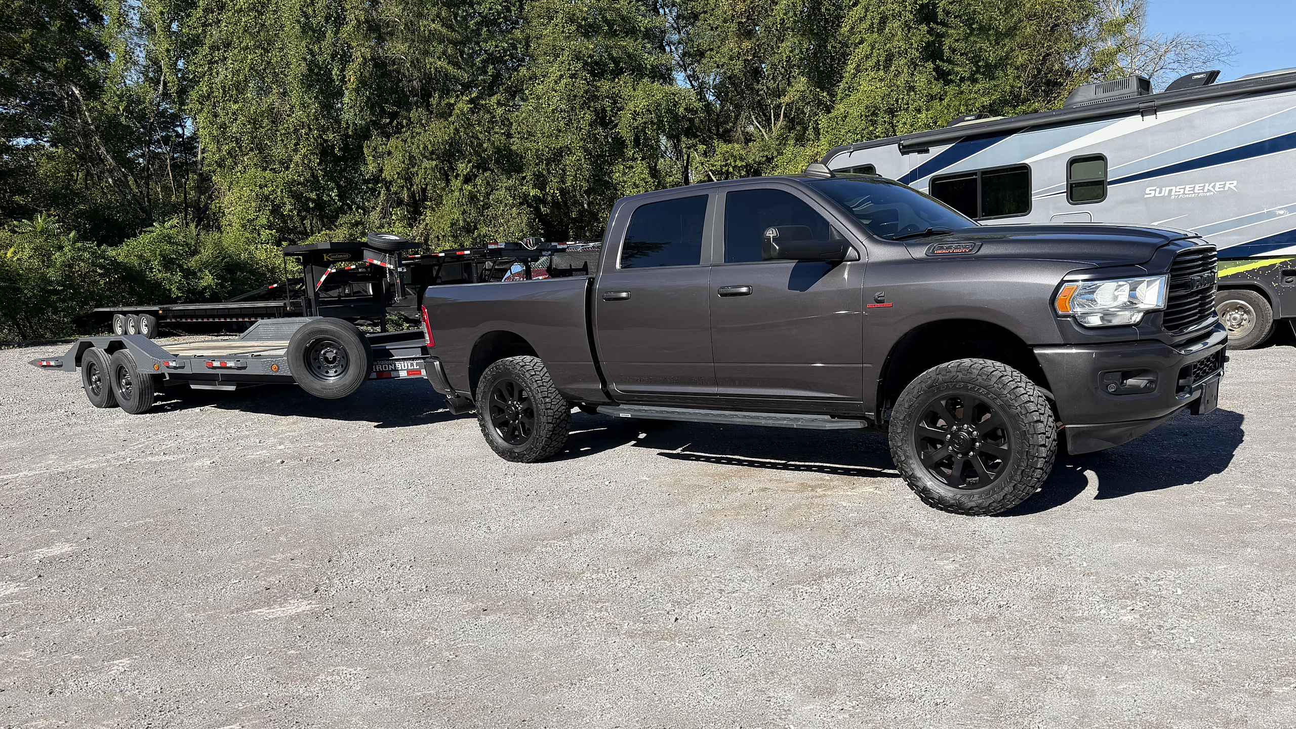 Our RAM 2500 and one of our tilt trailers ready to work!
